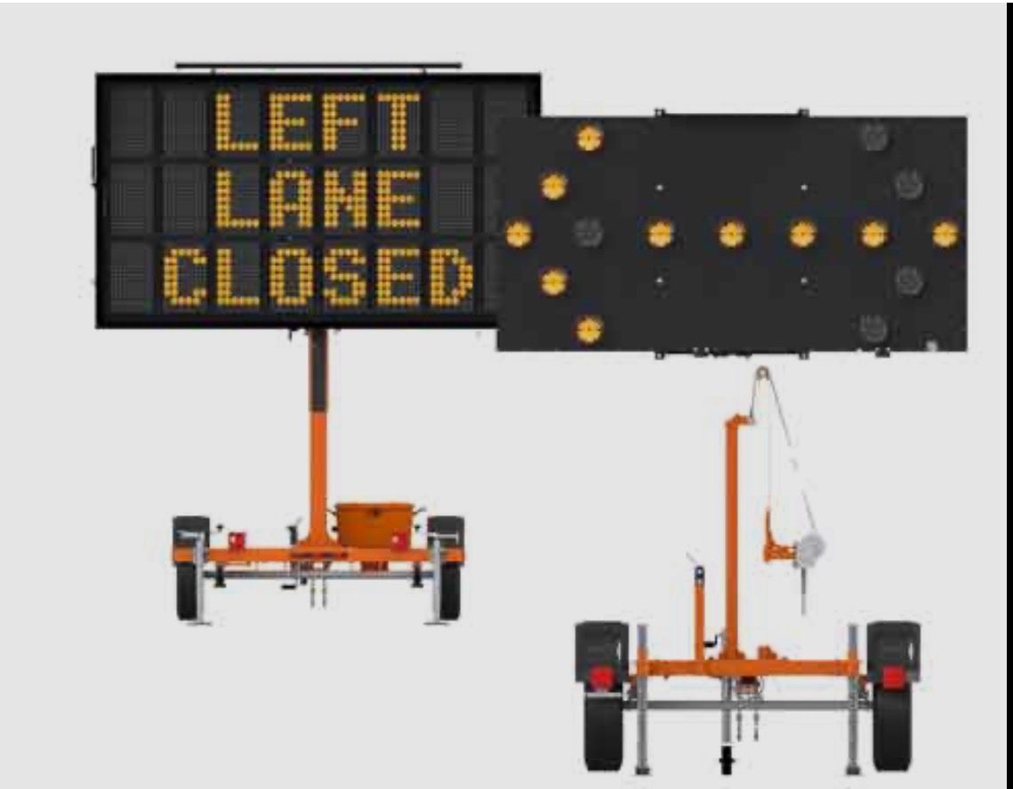 Portable orange road sign trailer displaying “LEFT LANE CLOSED” with amber warning lights