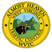 West Virginia Traffic Control emblem with road worker, mountains, and a yellow rope border