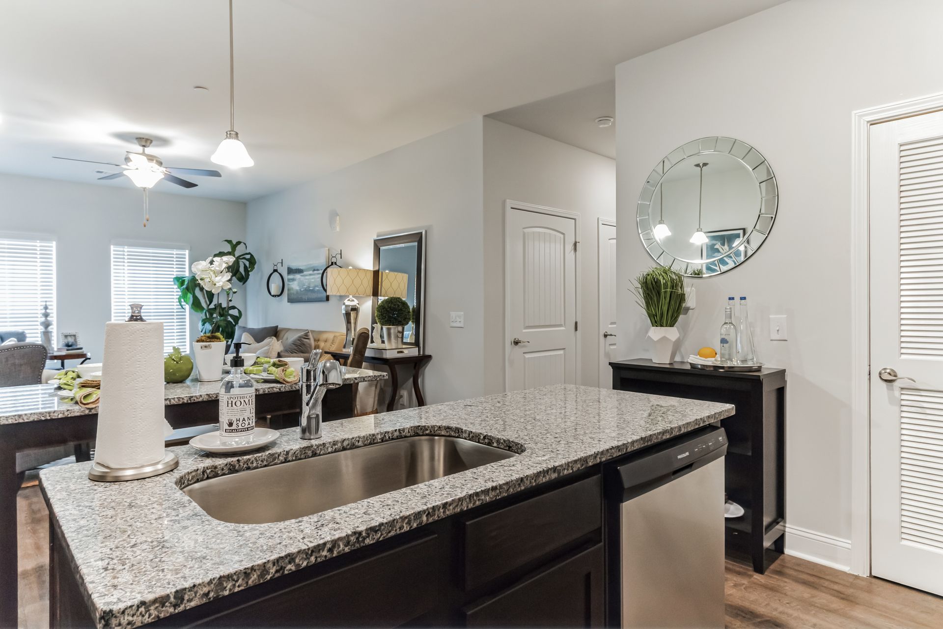 Open concept kitchen with stainless appliances and granite countertops and dishwasher