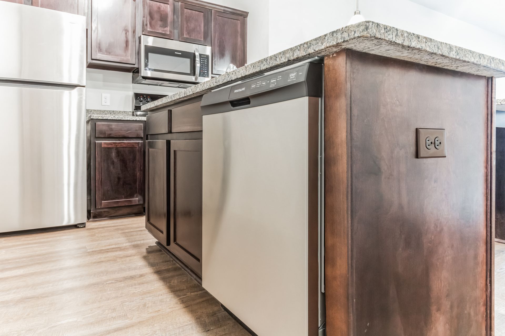 Open Concept Kitchen with Granite Countertops and Stainless Dishwasher