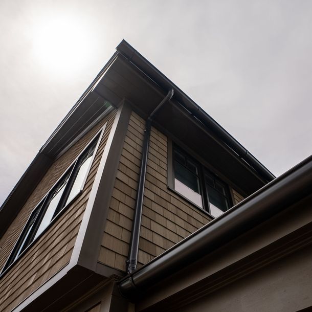 A ladder is attached to the side of a building.