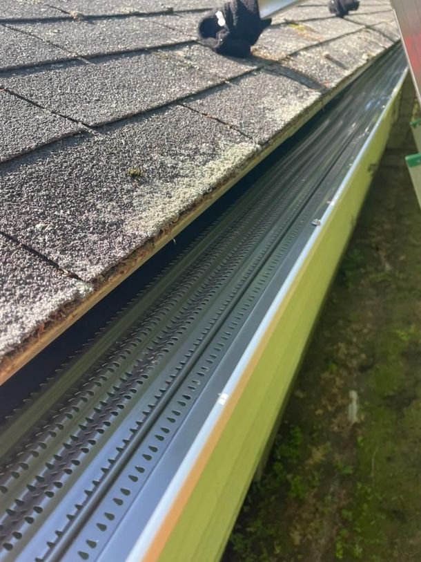 A close up of a gutter on top of a roof.