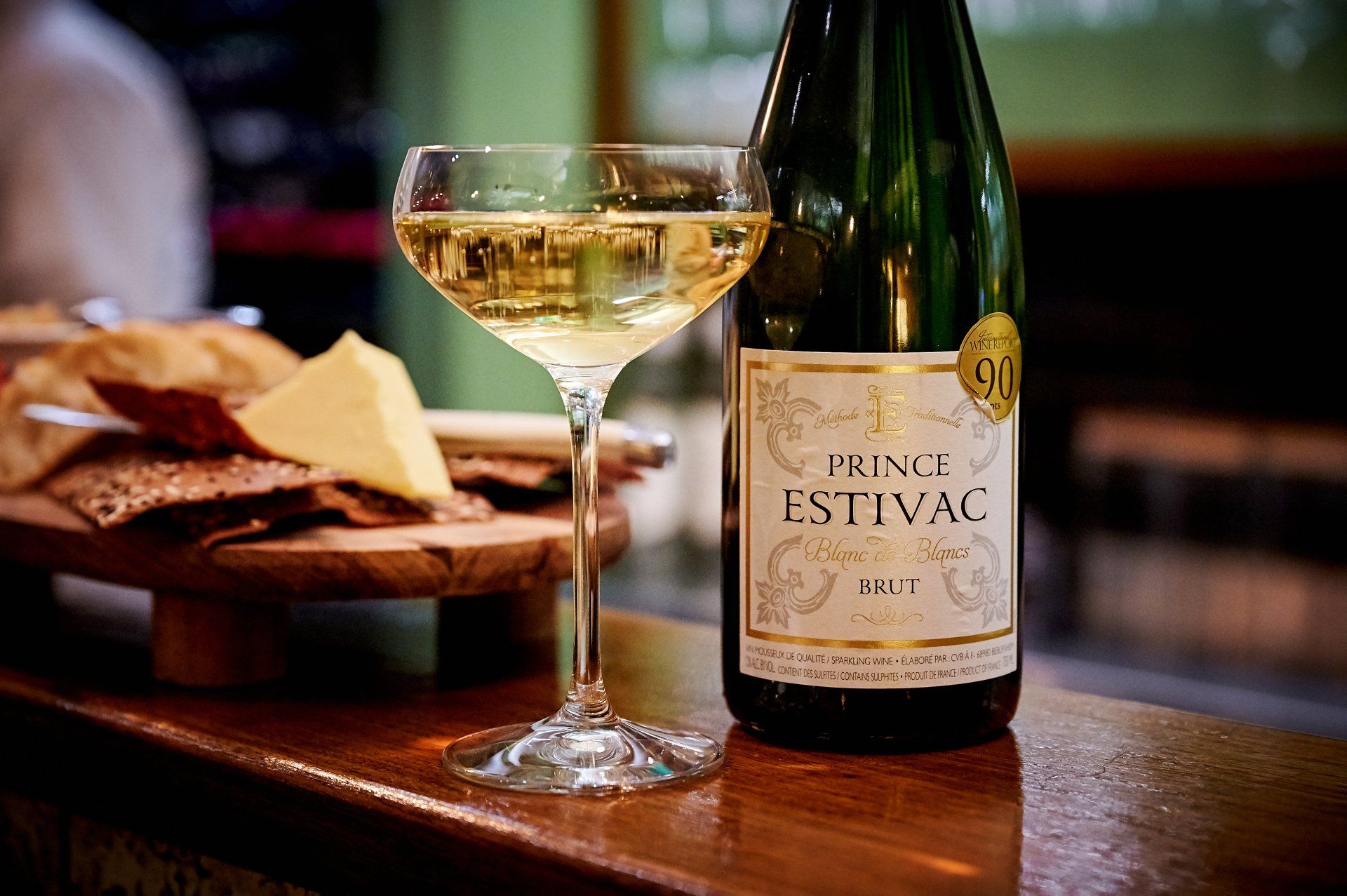Glass of sparkling wine and bottle of 