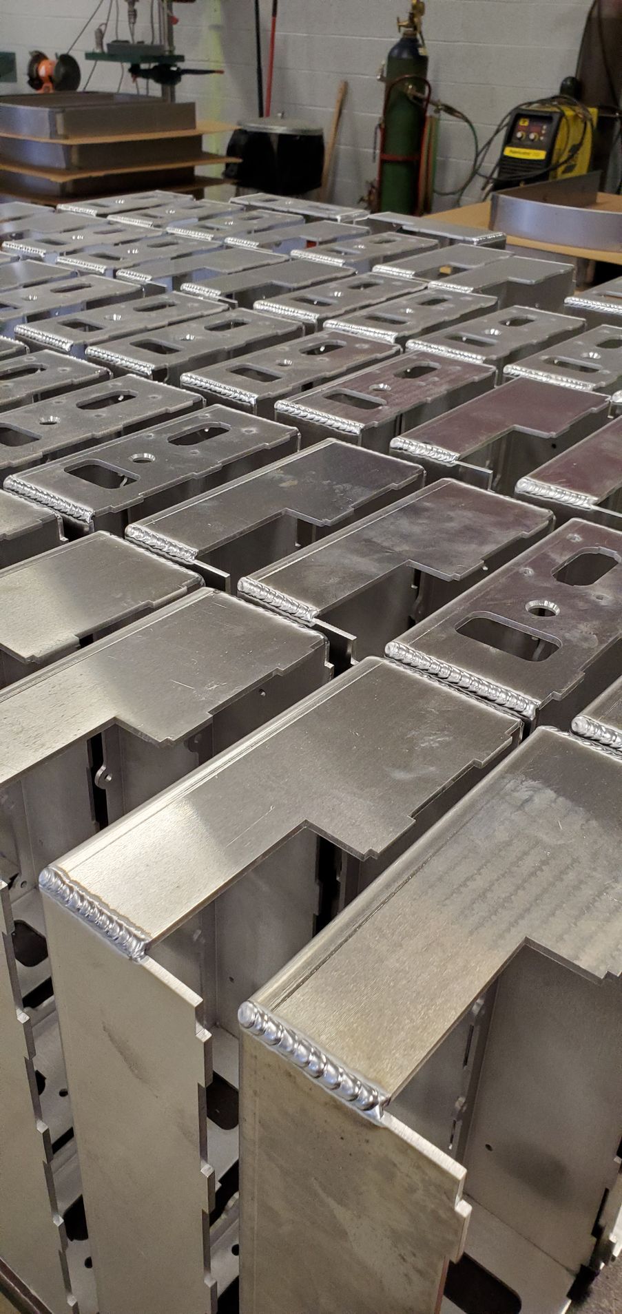 A bunch of metal pieces are sitting on top of each other on a table.