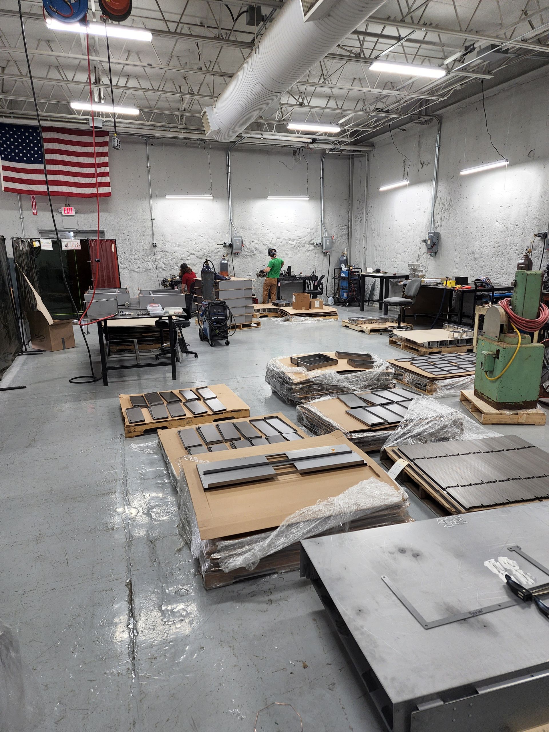 A large room filled with lots of boxes and machinery.