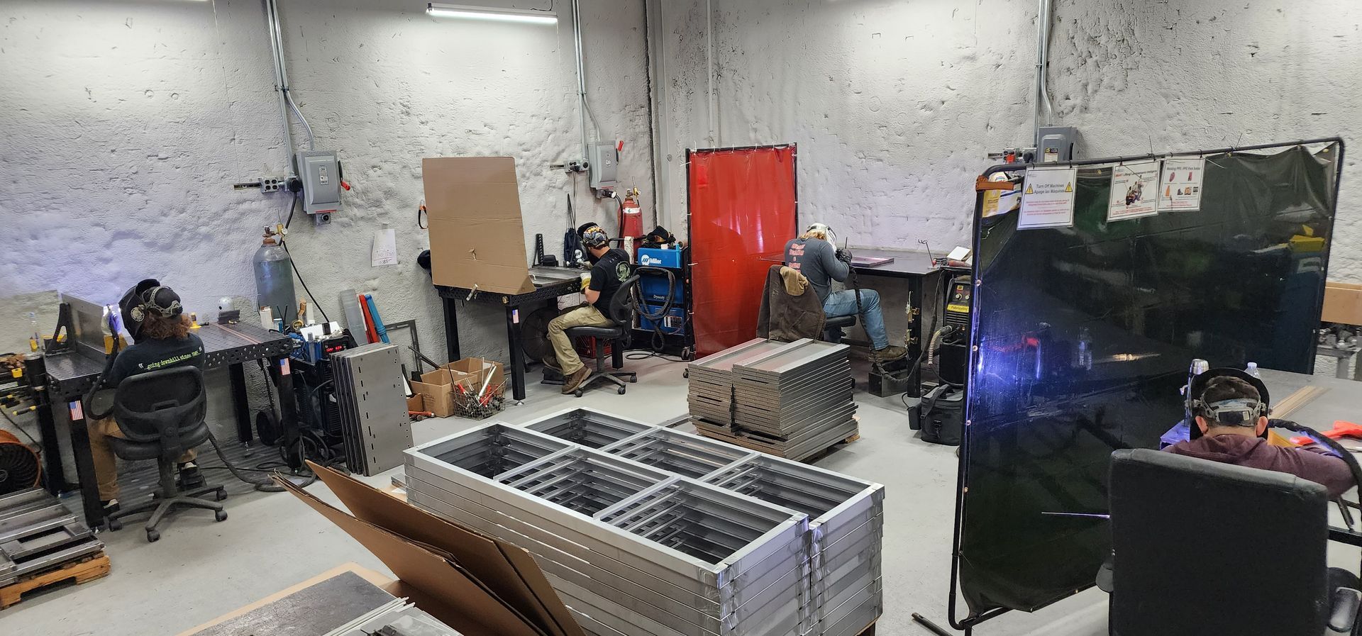 A warehouse filled with lots of boxes and tables.