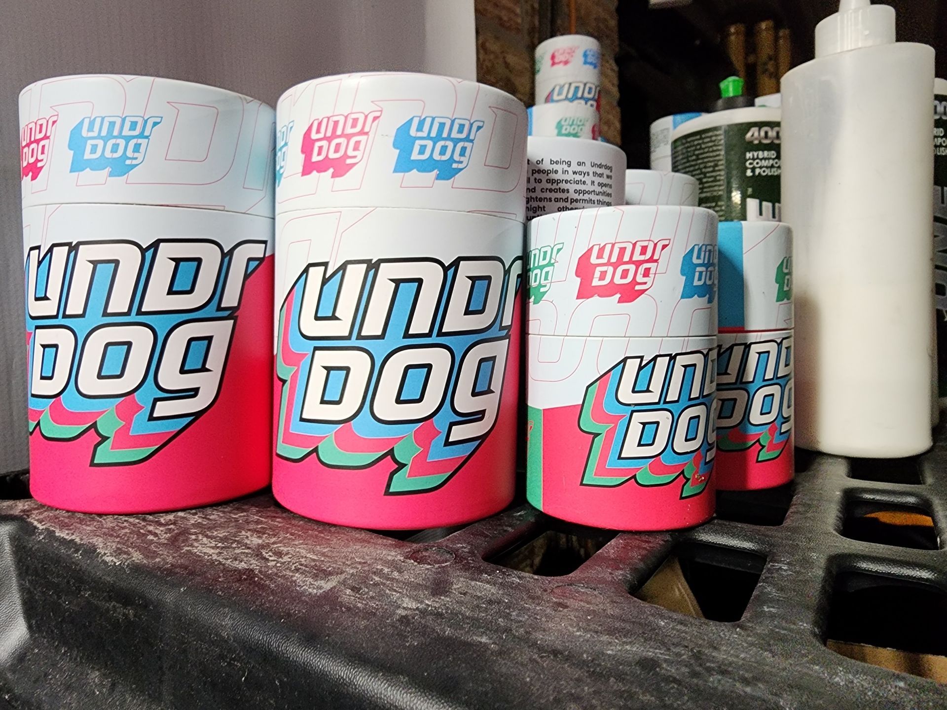 A bunch of under dog products are sitting on a table