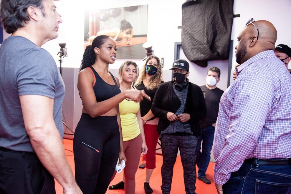 An intense scene with actors rehearsing.