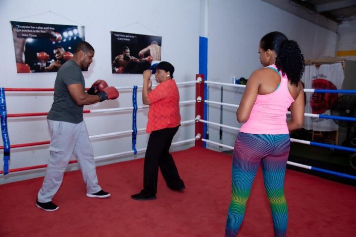 Director Jillian Bullock (also fight choreographer) works with actors Atif Lanier and Jacinth Headlam.