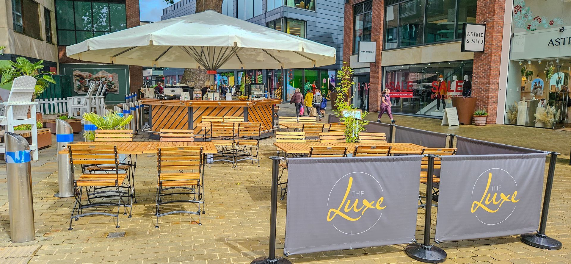 A restaurant with tables and chairs and a sign that says aline