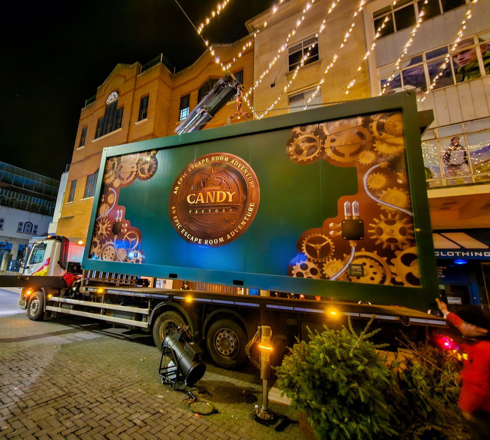 A large screen on the back of a truck says candy
