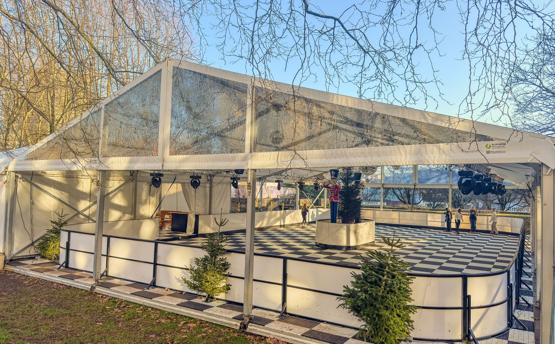 A large clear tent with a checkered floor