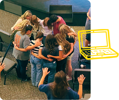 Group huddled around a person on a stage, with a yellow laptop icon overlay at right.