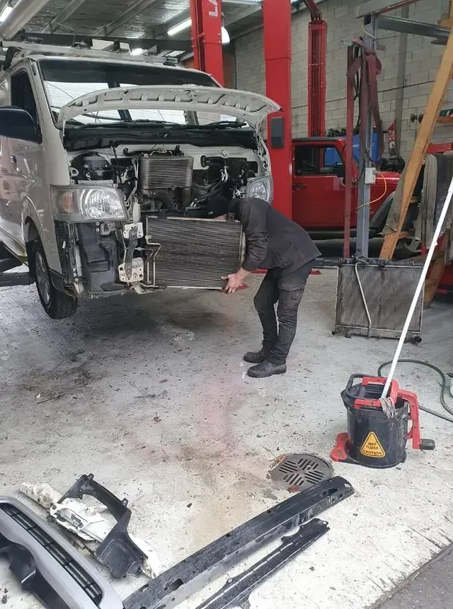 Person Working on a Van in a Garage — COOTA Automotive Services in Ballarat East, VIC