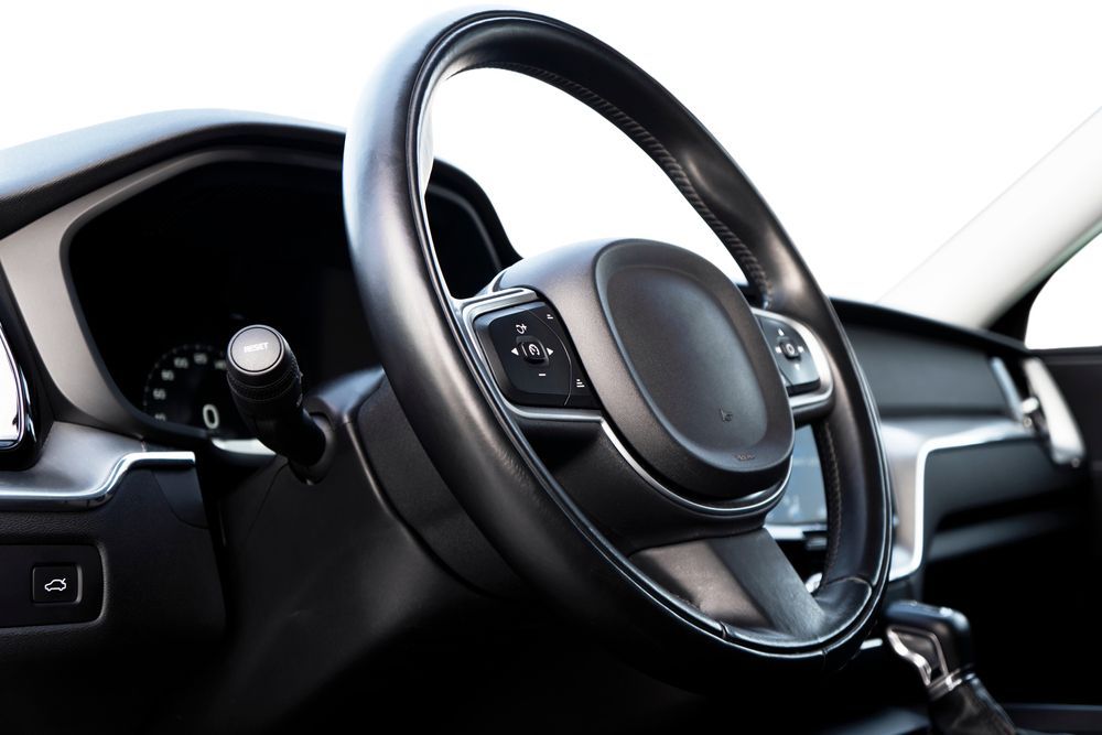 Black Car Steering Wheel and Dashboard — COOTA Automotive Services in Ballarat East, VIC