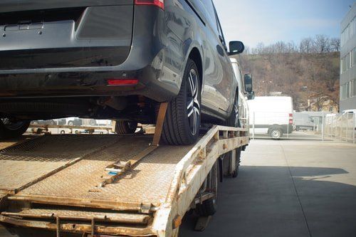 picture of a junk car being towed in minneapolis,mn.