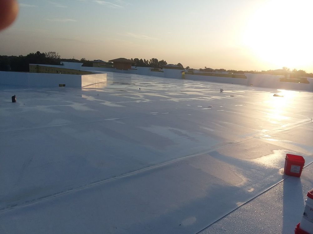 White roof reflecting sunlight, possibly recently coated.
