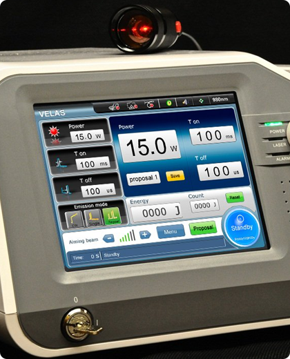 Laser therapy machine control panel displaying settings for power, time, and other parameters.