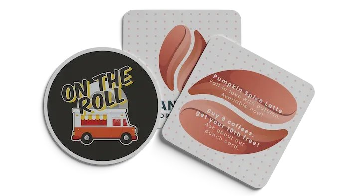Two promotional drink coasters, one circular with a food truck graphic and one square with coffee loyalty information.