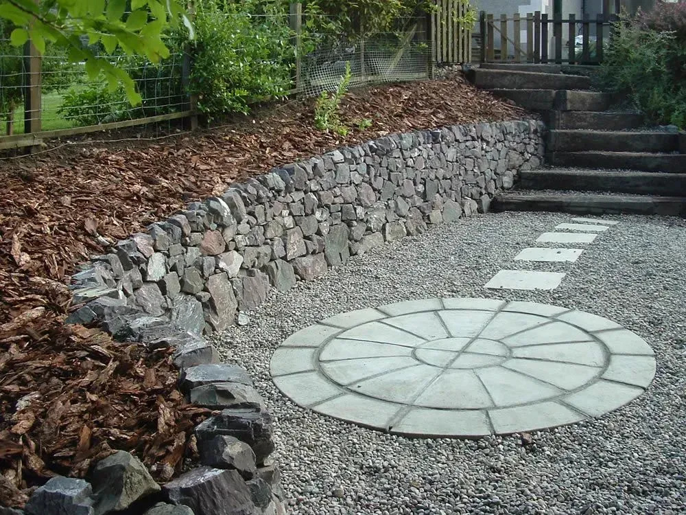 A stone walkway with a circle in the middle.