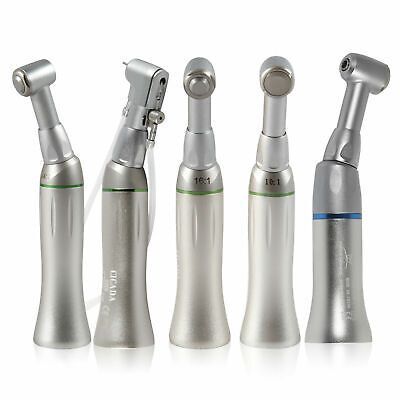 A group of dental instruments are sitting next to each other on a white surface.