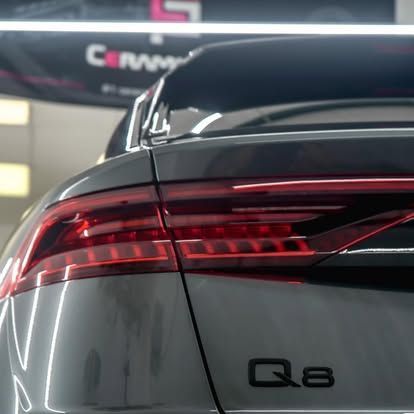 Close-up of a gray Audi Q8's taillights and