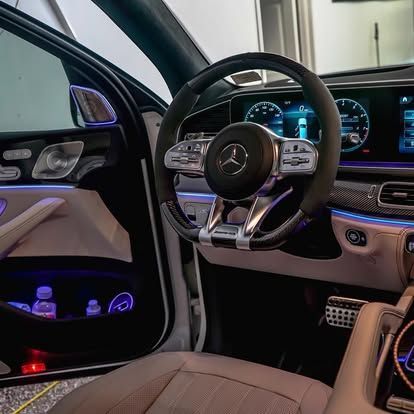 A close up of the interior of a car with the door open.