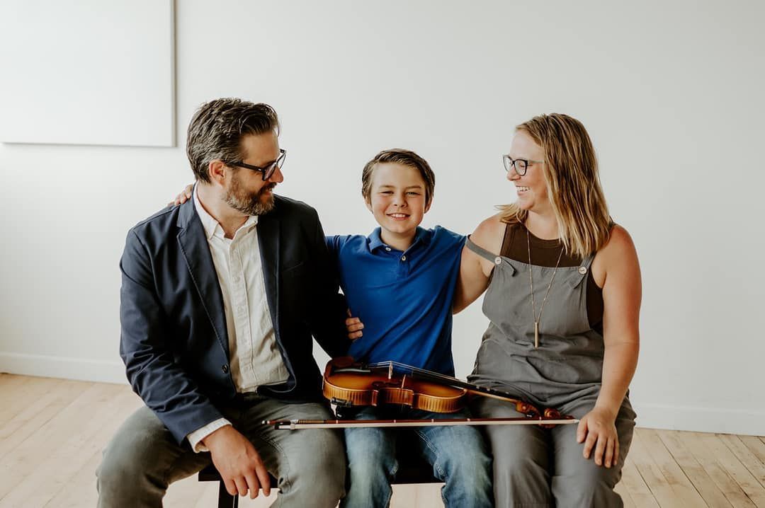 Parents participating alongside their child in Suzuki parent education classes at Lakewood Suzuki Strings