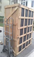 A group of men are moving a large hot tub 28.4845° N, 81.2519° W