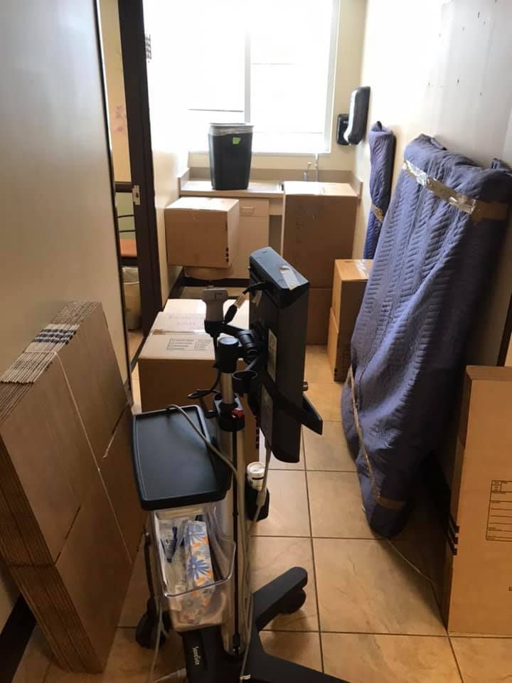 A room filled with boxes and a computer monitor.