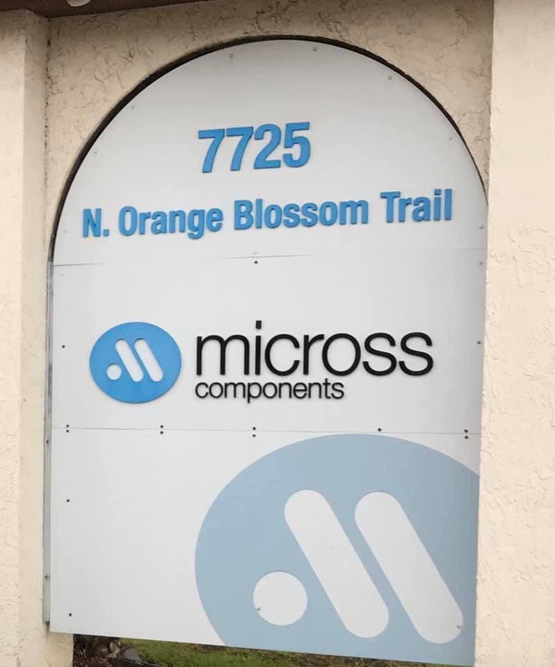 A sign that says micross components on it 28.4845° N, 81.2519° W