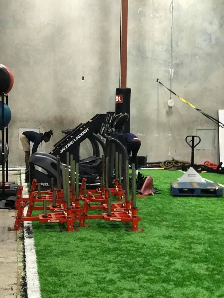 A gym with a lot of exercise equipment on the floor. 28.4845° N, 81.2519° W