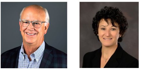 A man and a woman are smiling for the camera.