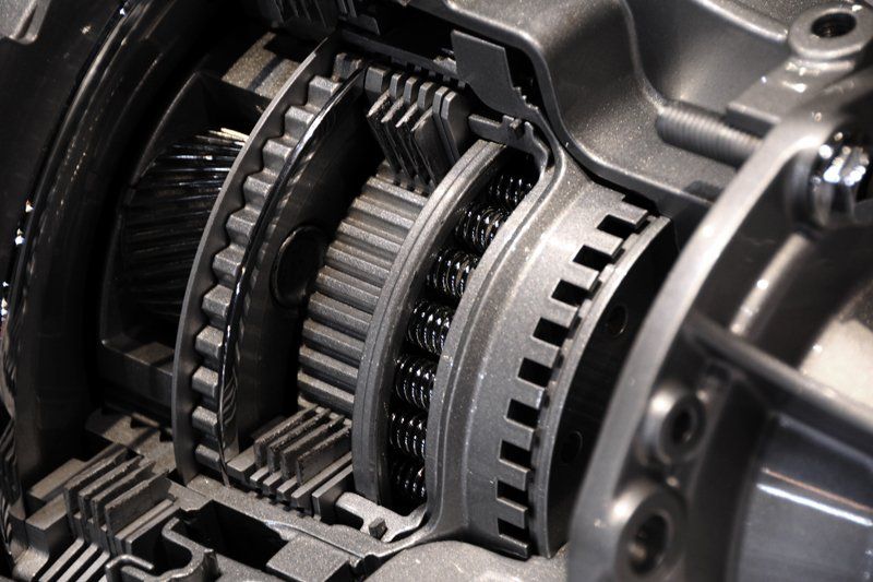 A close up of a gearbox in a car.