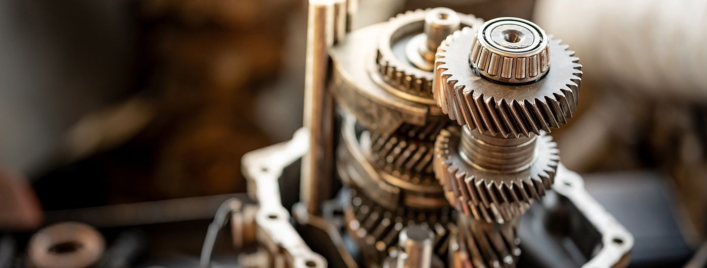 Close-up of gears, possibly from a vehicle transmission, showcasing mechanical components.