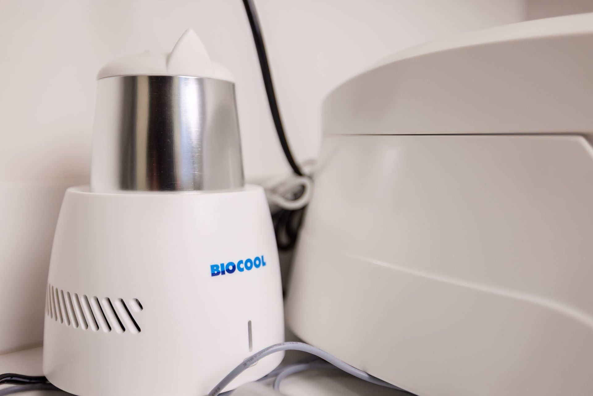 BIOCOOL unit beside the Bio-PRF centrifuge in our CARE Esthetics suite