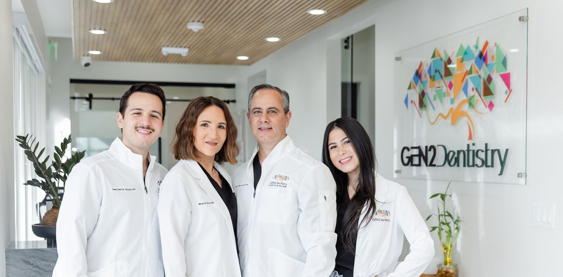 Dr. Escabí, Dr. Garcia and two team members by the GEN2 Dentistry sign