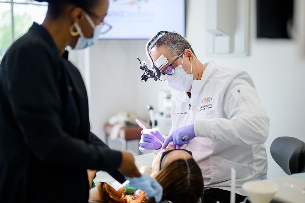 Dr. Paul Garcia and an assistant during a cosmetic dental visit
