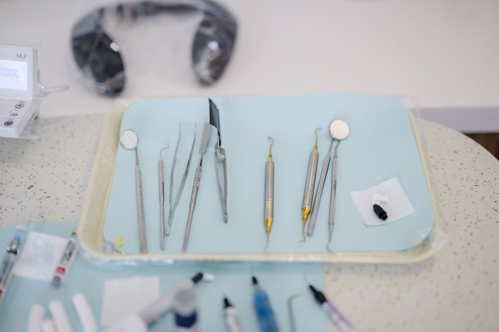 Dental cleaning instruments laid out on a tray at GEN2 Dentistry