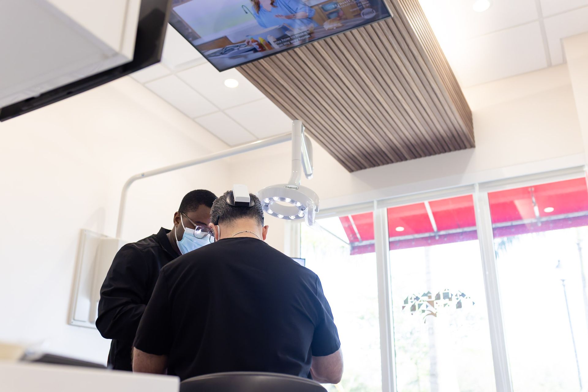 Dental team seating a patient in a GEN2 Dentistry treatment room