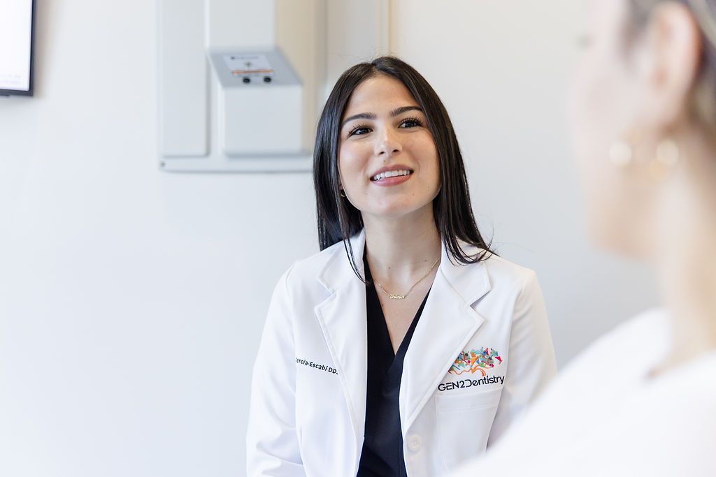 Dentist smiling during an emergency dental consultation