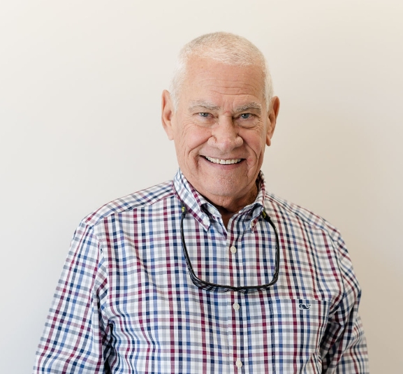 Smiling older man in a plaid shirt at GEN2 Dentistry