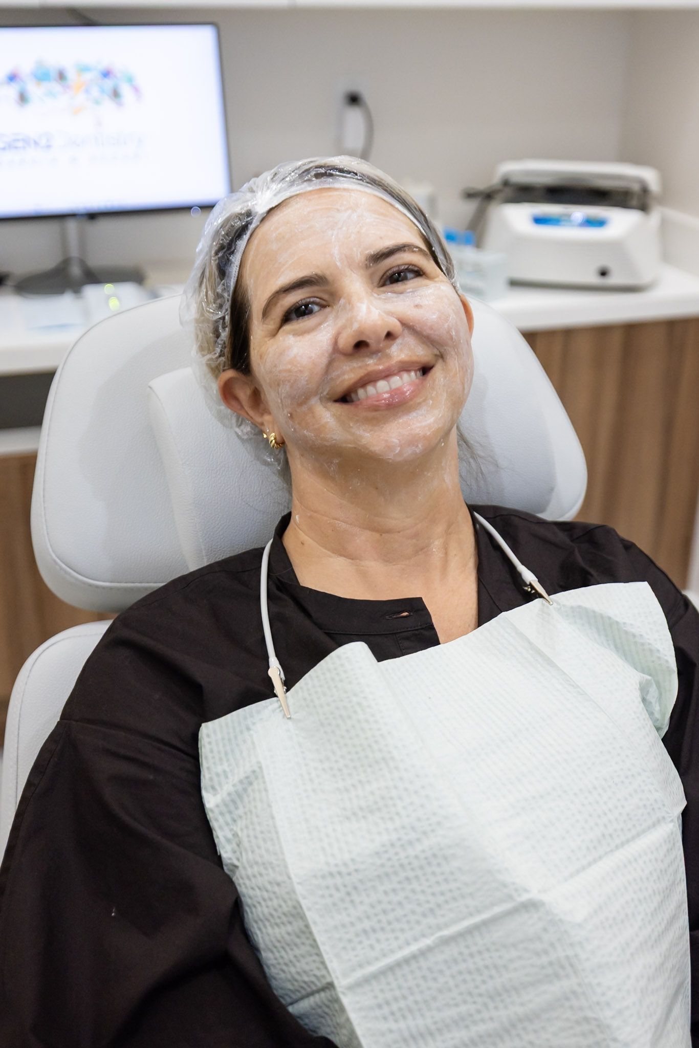 Patient smiling in the dental chair at GEN2 Dentistry
