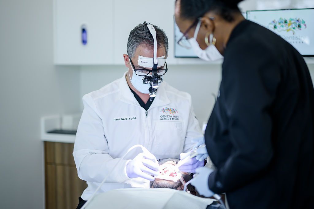 Dr. Paul Garcia and an assistant during a laser dentistry visit