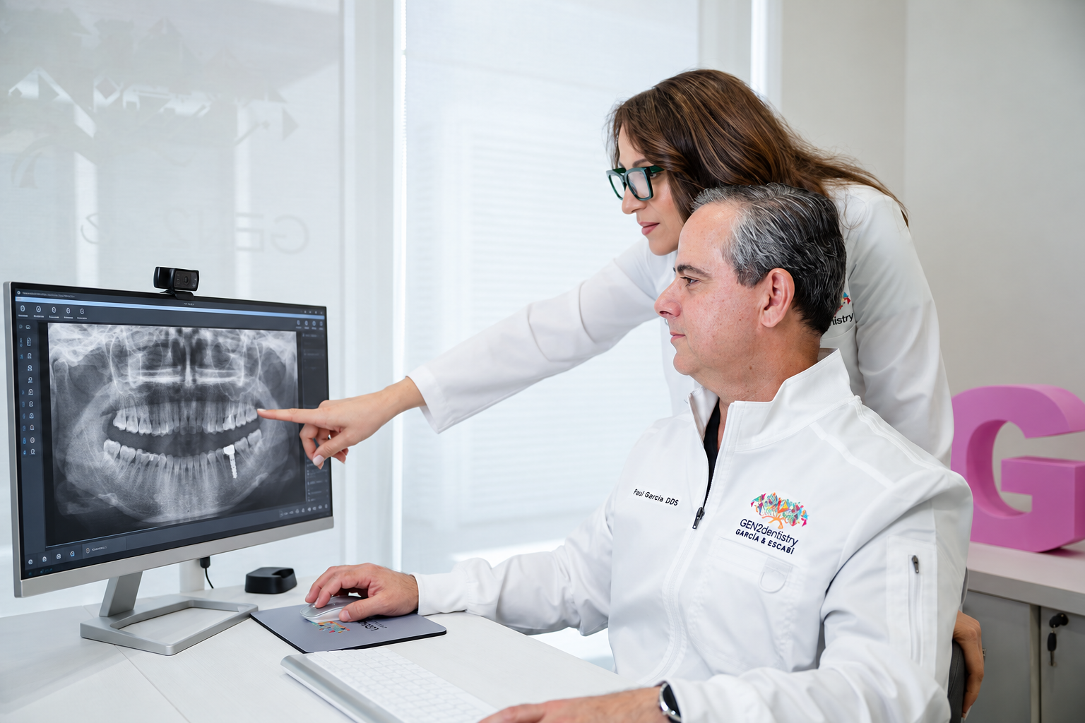 GEN2 Dentistry doctors reviewing a panoramic X-ray in Davie, FL