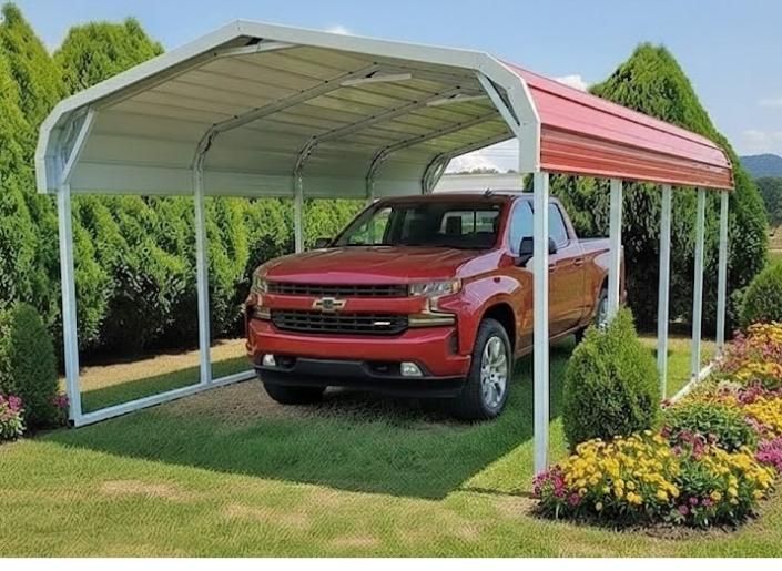 Red pickup truck parked under a white and red carport beside a landscaped garden