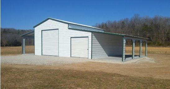 White metal garage with two doors and a covered side porch