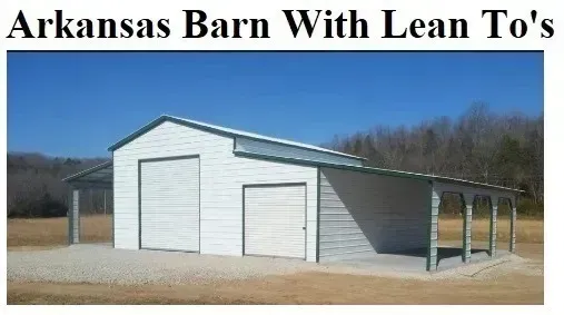 White barn with two garage doors and lean-to side sheds