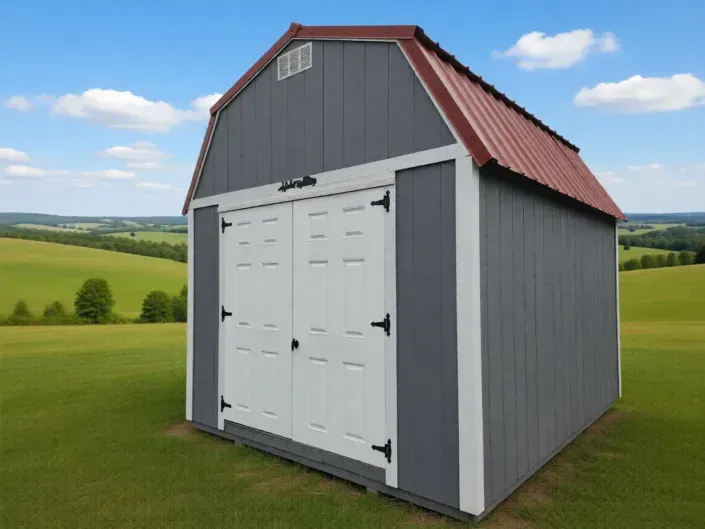 Gray garden shed with white double doors and red roof on a grassy field, with rolling hills in the background