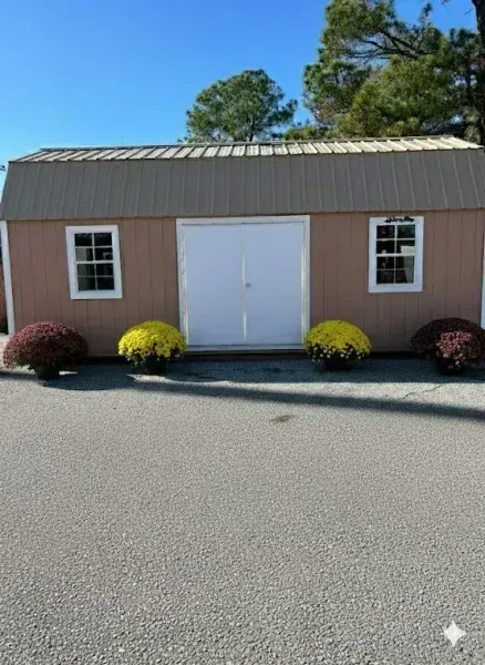 brown side lofted barn with double doors